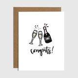 Brittany Paige champagne bottle greeting card featuring the text Congrats!, available at Be Charmed