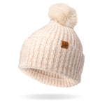 Cream Britt's Knits Kindred Pom Hat featuring a cozy knit winter beanie with a playful pom, available at Be Charmed