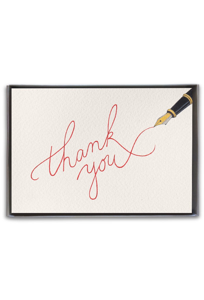 A boxed set of thank you cards with cursive writing on the front, accompanied by a cream envelope, presented in a clear slip cover. Available at Be Charmed