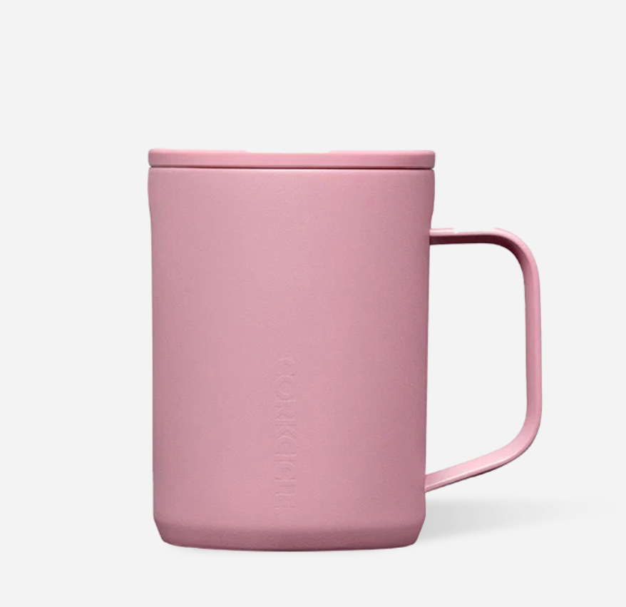 A desert rose ceramic mug with a matching lid and handle, featuring the embossed brand name Corkcicle on the front, set against a clean white background. Available at Be Charmed