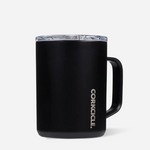 A matte black CorKicle insulated mug with a clear lid and a black handle, shown on a light gray background. Available at Be Charmed