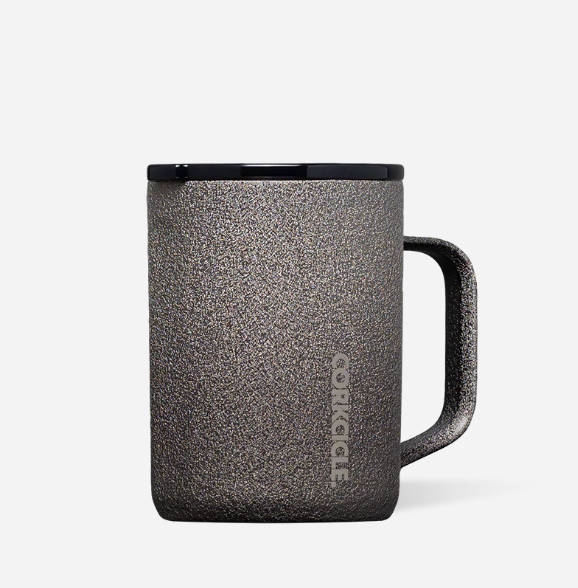 A steel shadow insulated travel mug , featuring the vertical brand name 'CORKCICLE' on the side, set against a plain light gray background. Available at BE Charmed
