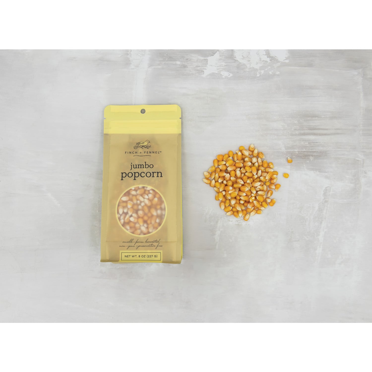 Finch + Fennel 8 oz Jumbo Popcorn packaging featuring gourmet popcorn kernels, available at Be Charmed