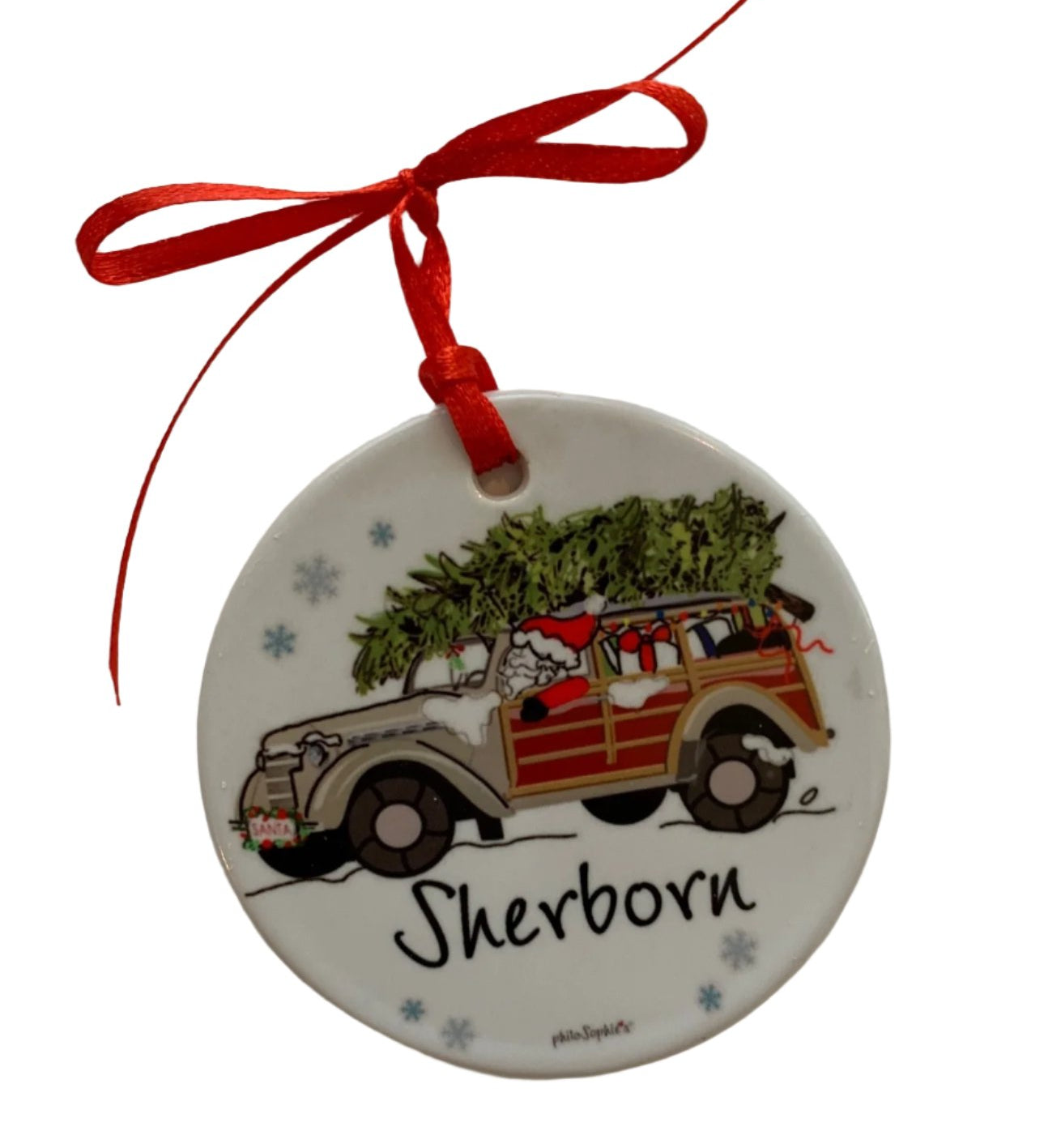 PhiloSophie's Santa in Woodie Sherborn ornament featuring a hand-illustrated vintage car with Santa and local town lettering, available at Be Charmed