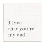 Rustic Marlin white decorative block with gray lettering that reads “I love that you’re my dad,” available at Be Charmed.