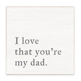 Rustic Marlin white decorative block with gray lettering that reads “I love that you’re my dad,” available at Be Charmed.