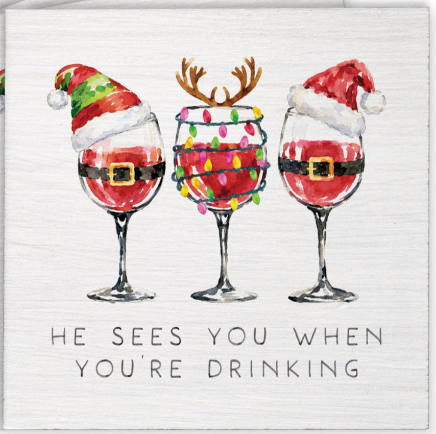 Rustic Marlin coaster featuring funny holiday text reading He Sees You When You're Drinking, available at Be Charmed