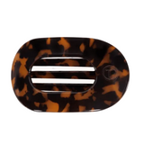 Medium Teleties flat round clip in tortoise pattern featuring a sleek geometric design, available at Be Charmed