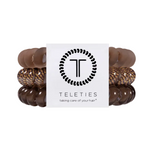Large eleties Morning Brew hair ties featuring a warm neutral spiral design, available at Be Charmed
