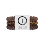 Small eleties Morning Brew hair ties featuring a warm neutral spiral design, available at Be Charmed