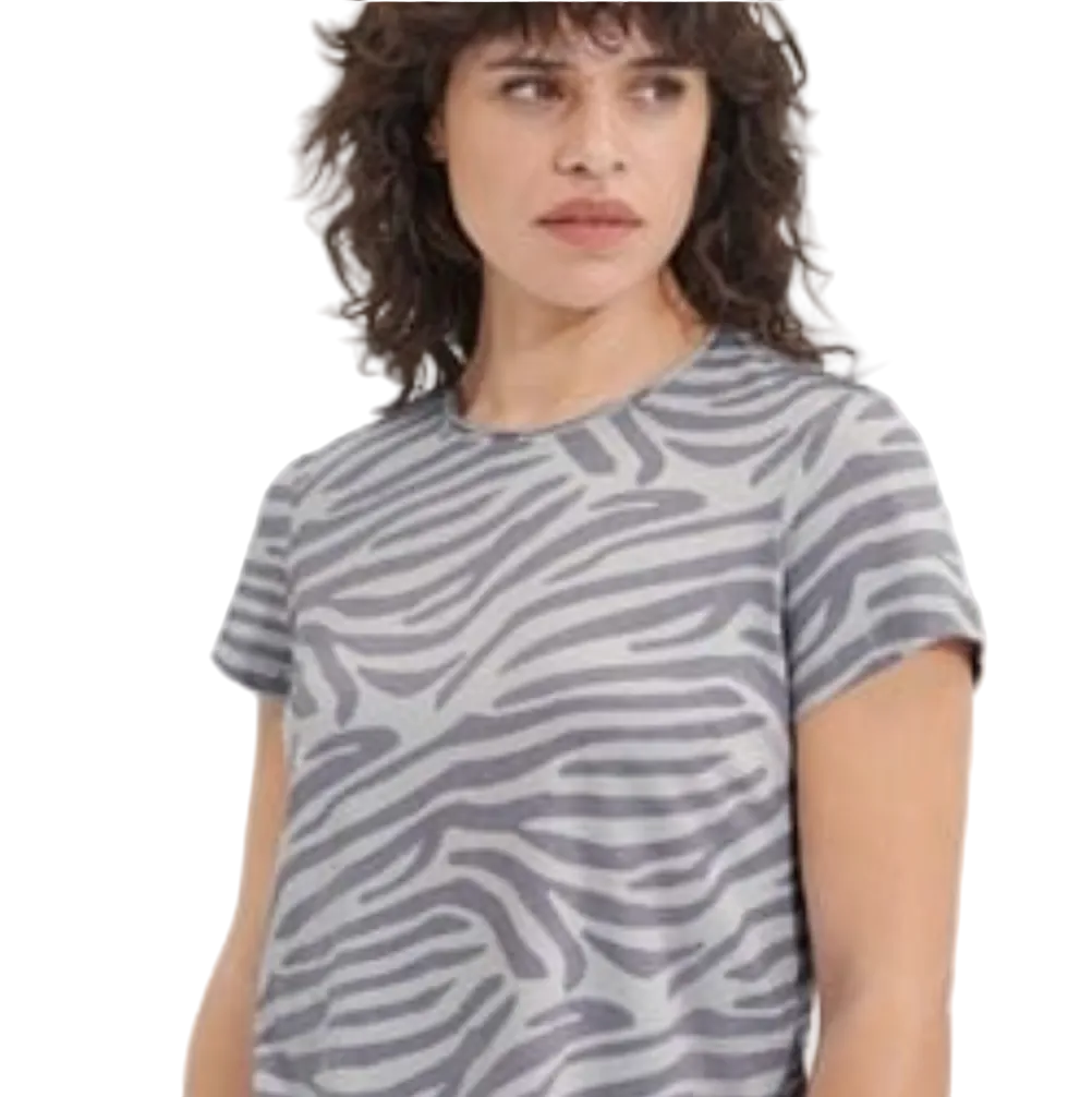 Person wearing a gray zebra pattern t-shirt on a white background. Available at be Charmed