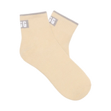 A pair of sea/salt ceramic UGG Polly ankle socks with gray detailing around the ankle area. Available at Be Charmed