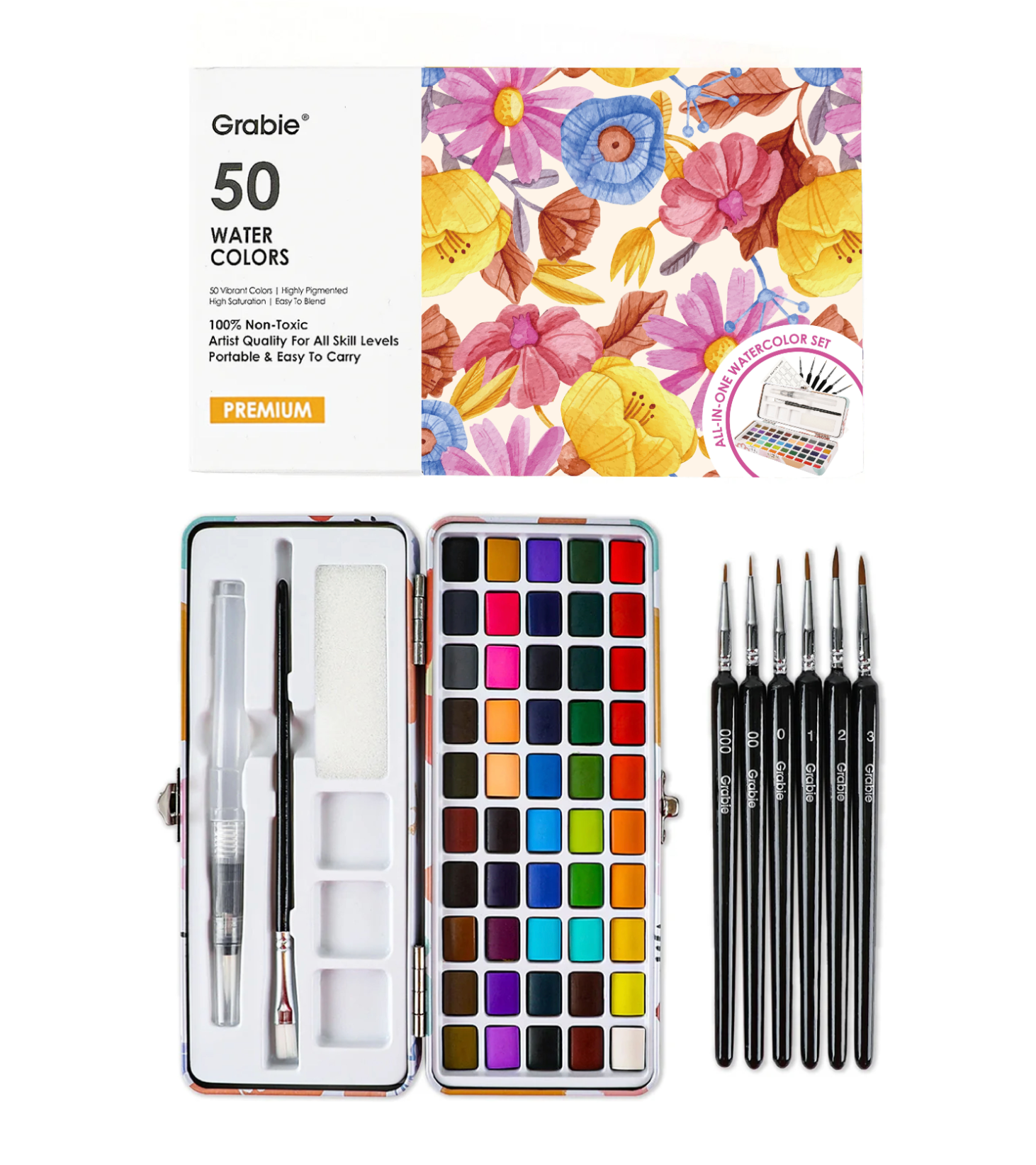 Grabie 50 Water Colors paint set shown open with a full array of 50 color pans, two brushes inside the case, and five black-handled paintbrushes beside it on a white background. Available at Be Charmed
