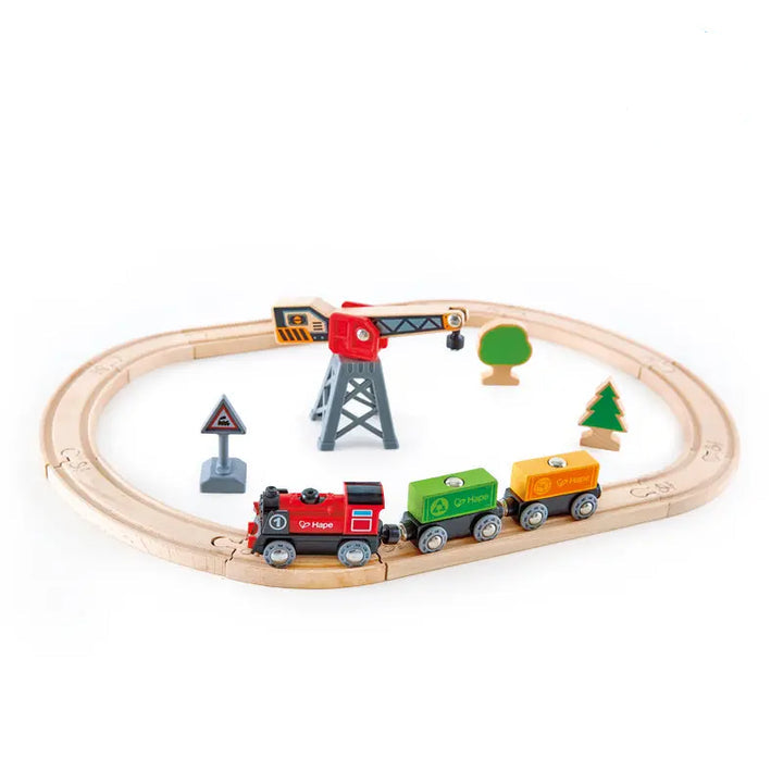 Hape cargo delivery loop featuring a wooden train track with delivery cars available at Be Charmed