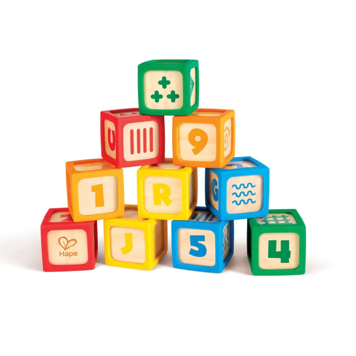 Hape Grip-n-Stack Silicone & Wood Blocks featuring colorful interlocking pieces available at Be Charmed
