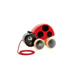 Hape ladybug pull along featuring a cute red wooden bug with moving wings available at Be Charmed