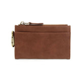 Brown leather wallet with a gold zipper on a white background. Available at Be Charmed