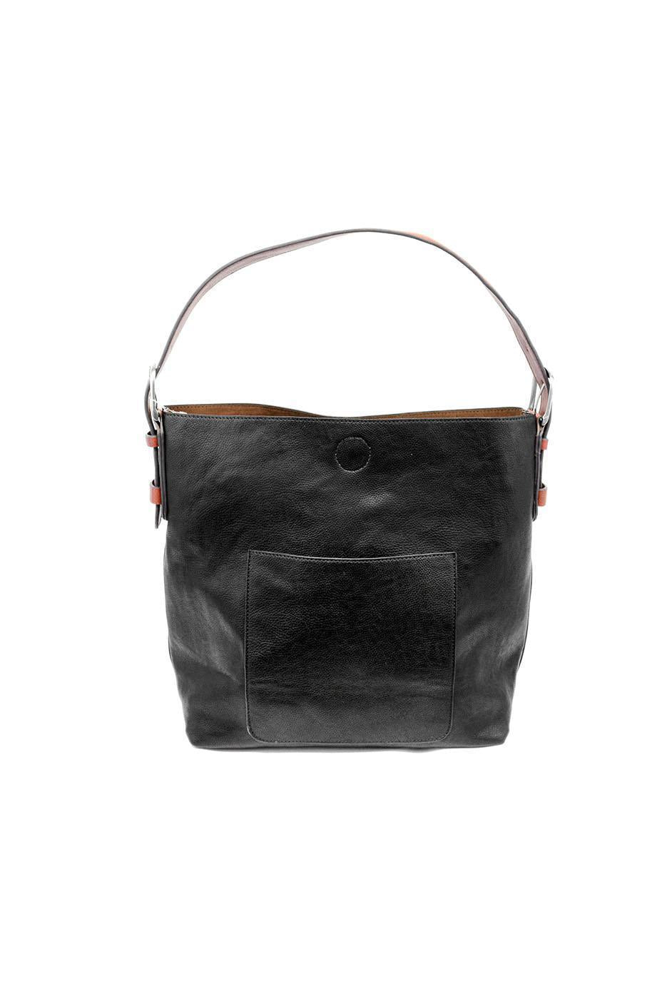 Black leather handbag with a handle on a white background. Available at Be Charmed