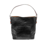 Black leather handbag with a handle on a white background. Available at Be Charmed