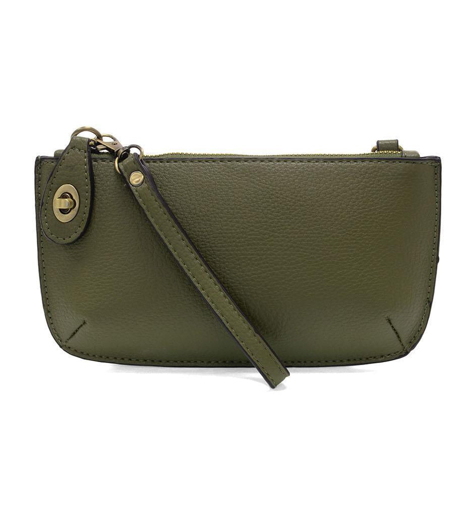 Joy Susan Olive Grove green leather crossbody bag on a white background. Available at Be Charmed