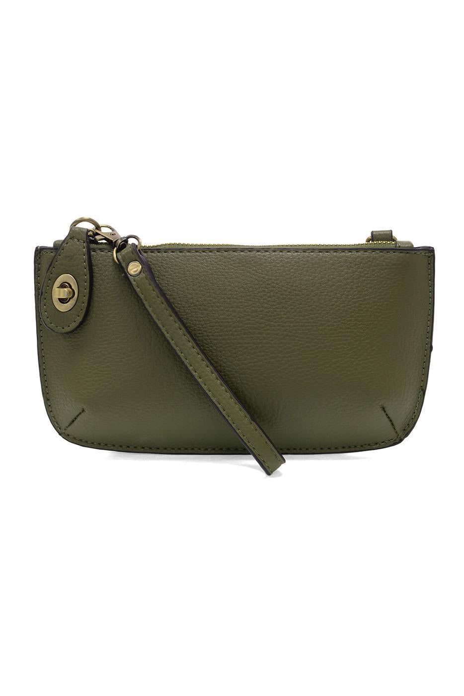 Joy Susan Olive Grove green leather crossbody bag on a white background. Available at Be Charmed