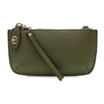 Joy Susan Olive Grove green leather crossbody bag on a white background. Available at Be Charmed