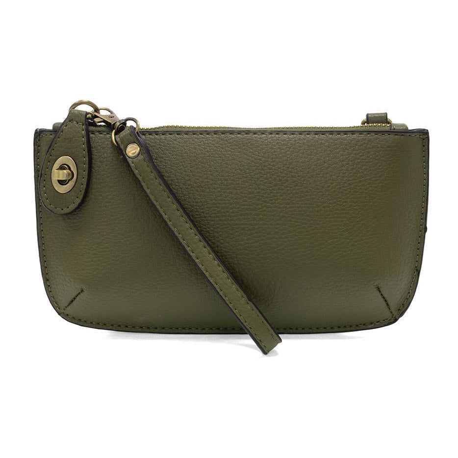Joy Susan Olive Grove green leather crossbody bag on a white background. Available at Be Charmed