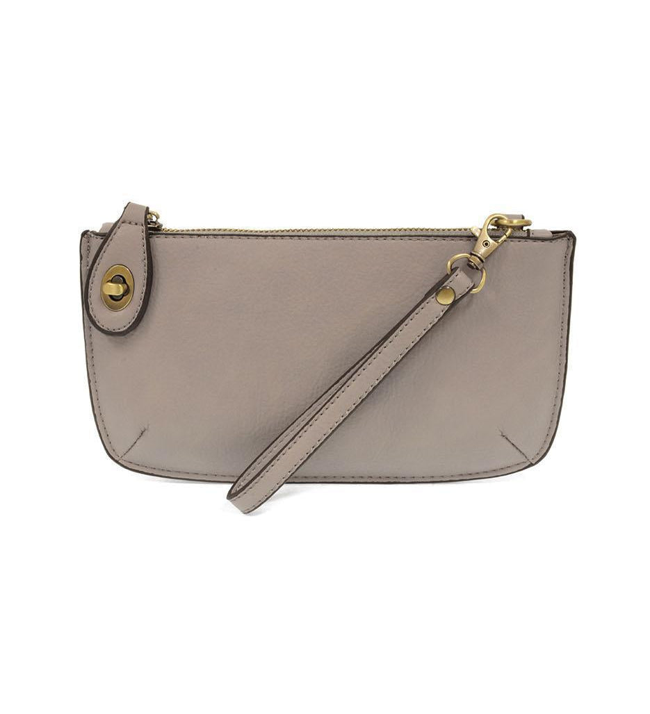 Joy Susan Gray wristlet purse with a strap on a white background. Available at Be Charmed