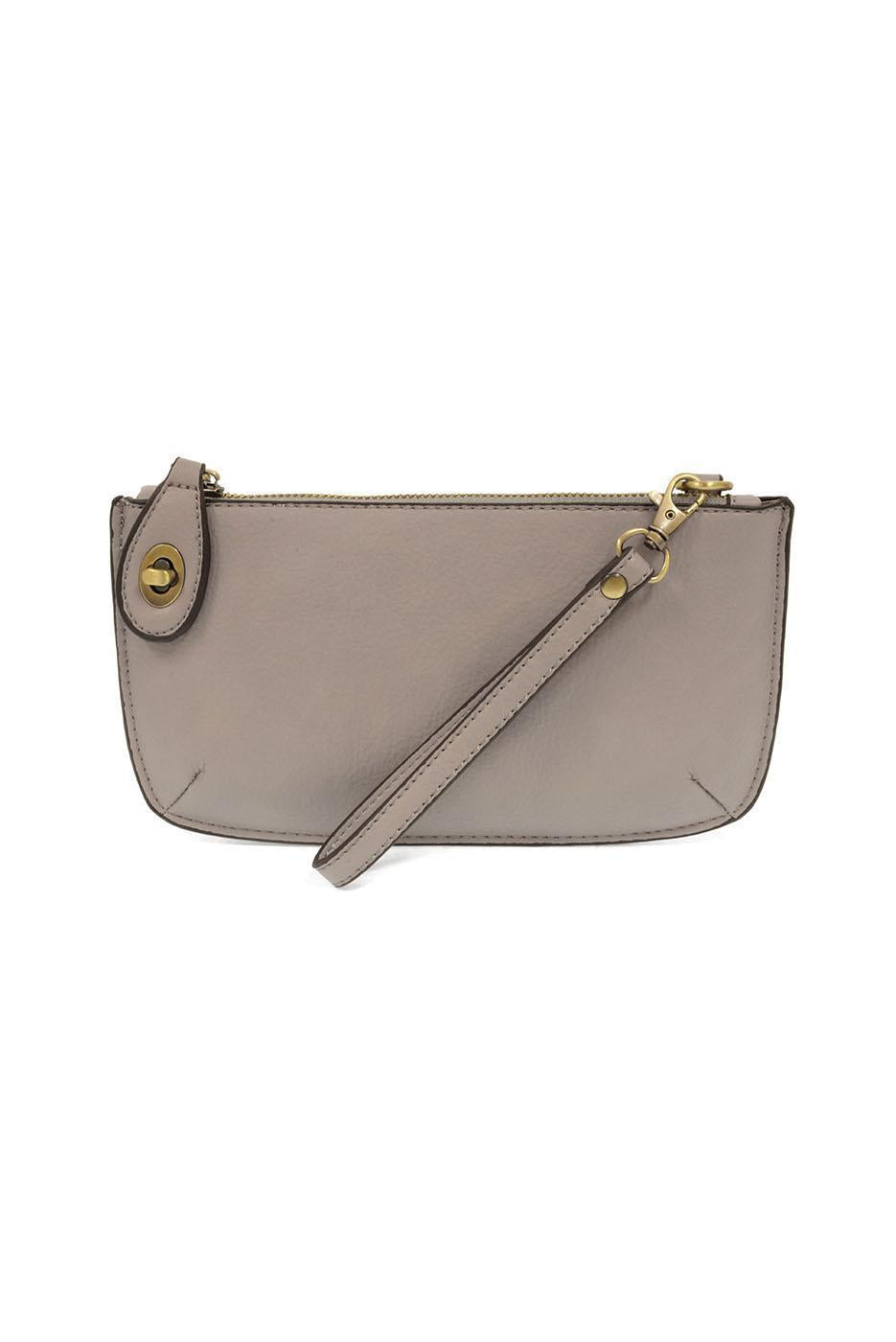 Joy Susan Gray wristlet purse with a strap on a white background. Available at Be Charmed