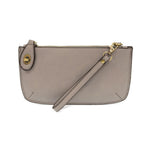 Joy Susan Gray wristlet purse with a strap on a white background. Available at Be Charmed