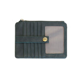 A Joy Susan castleton green card holder wallet with multiple card slots, a horizontal strap with a gold snap button, and a clear ID window on the right side, shown against a plain white background. Available at Be Charmed