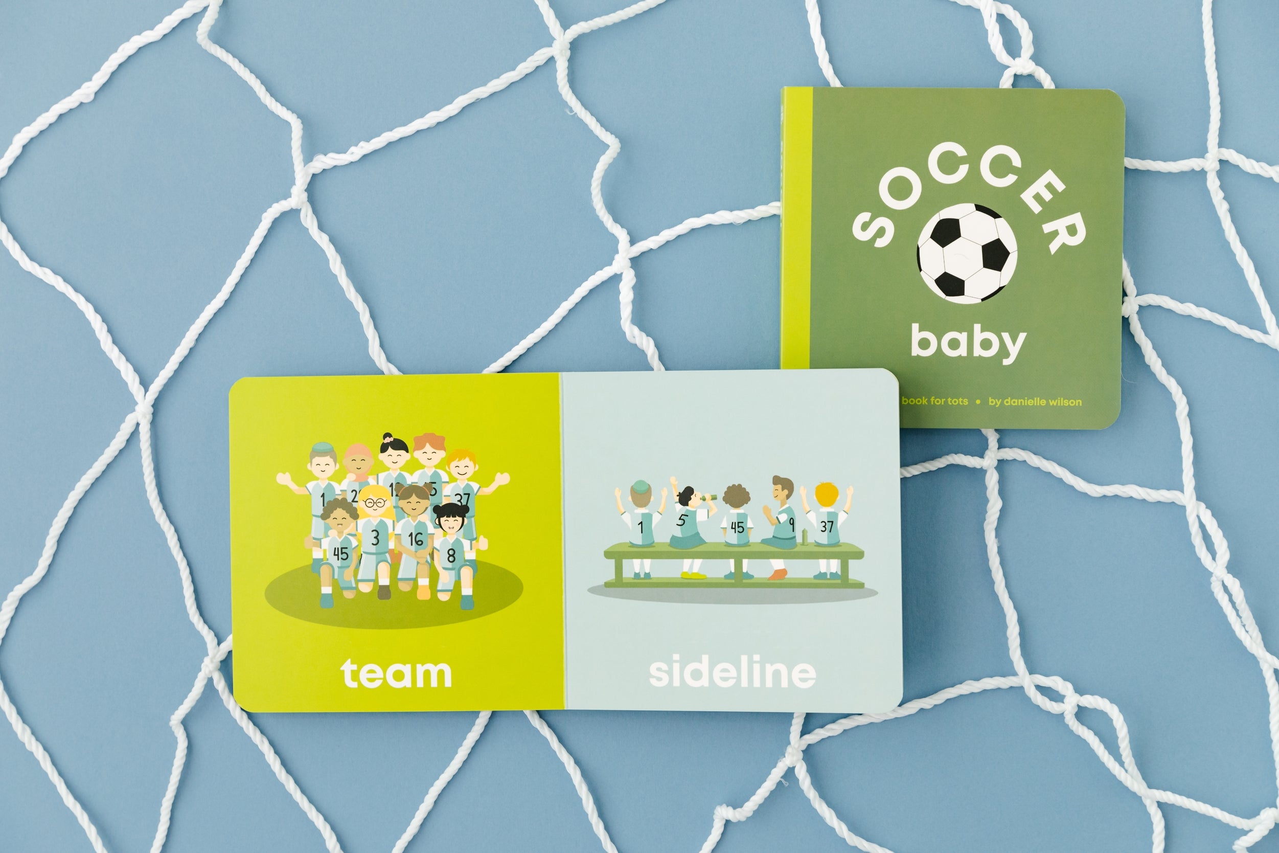 Left Hand Book House Soccer Baby Board Book available at Be Charmed