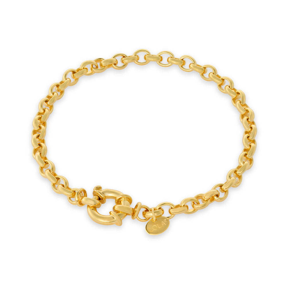 A Lola Rolo gold chain bracelet with a lobster clasp and a small oval tag, displayed on a clean white background. Available at Be Charmed