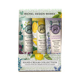 Michel Design Works botanicals hand cream collection with three different scents in a box on a white background. Available at Be Charmed