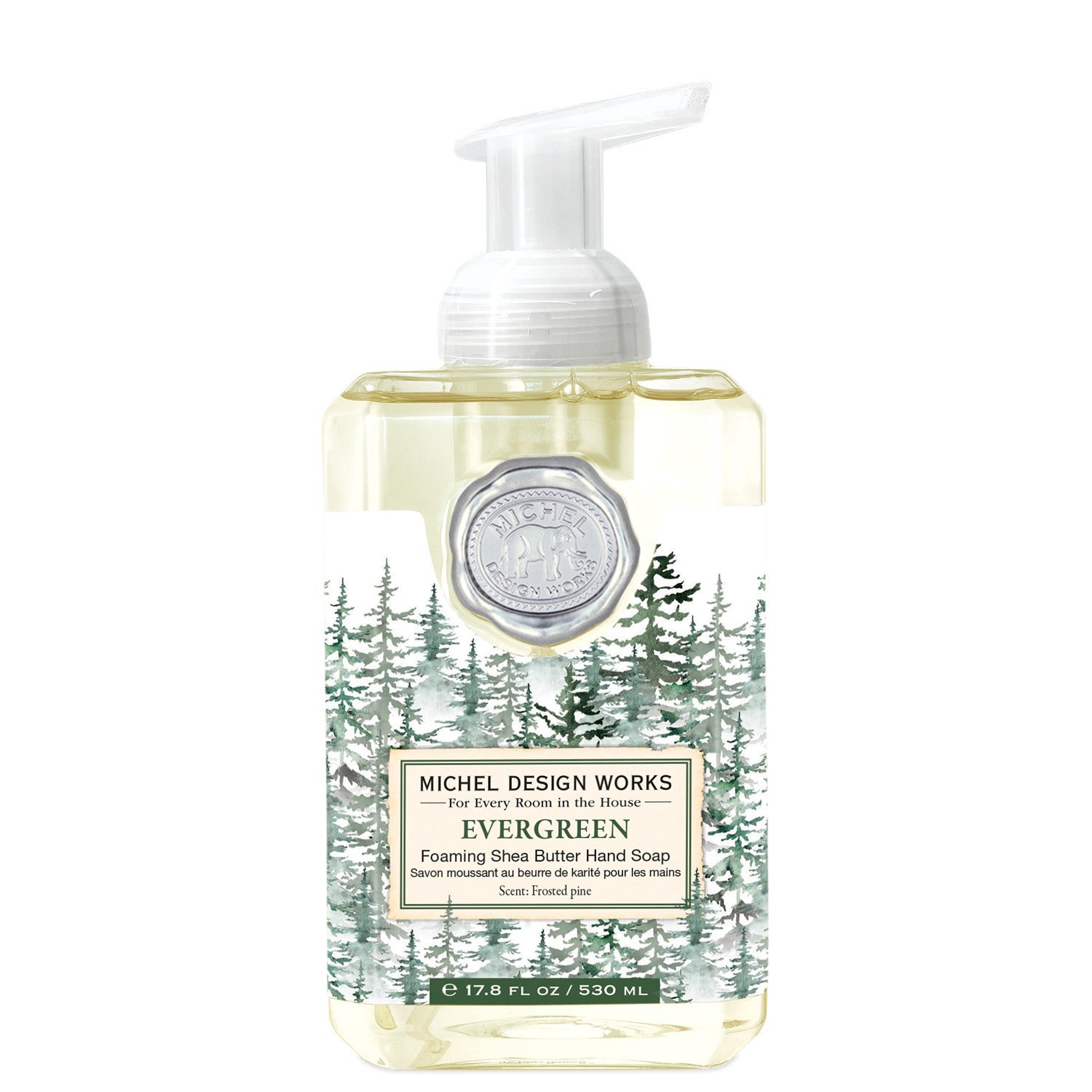 Michel Design Works foaming hand soap bottle with evergreen design on a white background. Available at Be Charmed