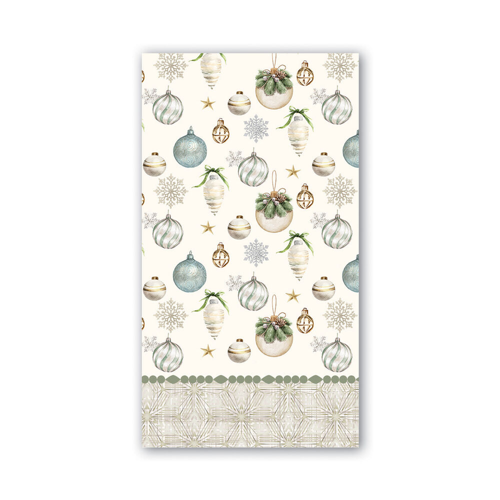 A rectangular holiday-themed hostess napkin, featuring a cream background with watercolor-style Christmas ornaments, snowflakes, stars, and a patterned border at the bottom. Available at Be Charmed