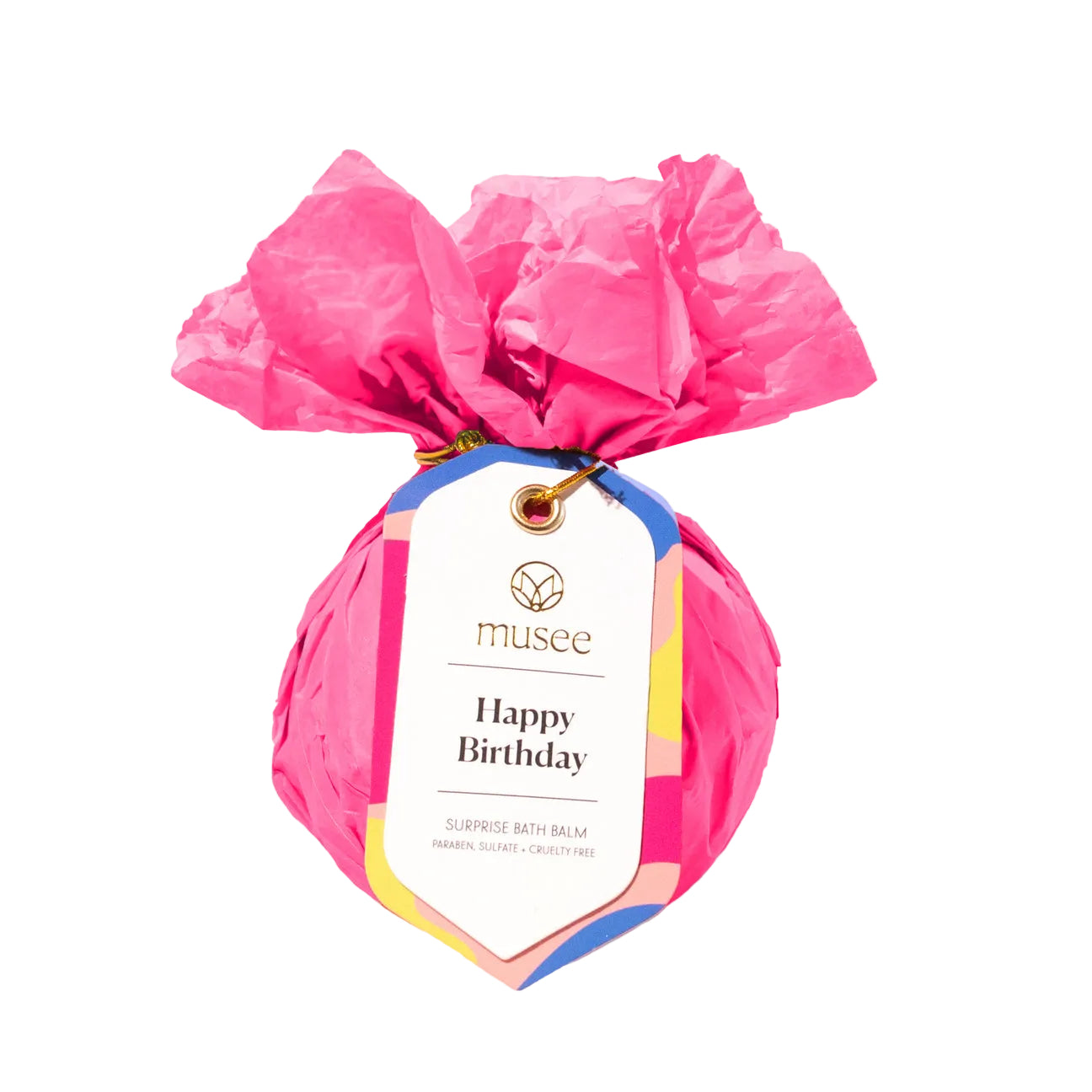 Musee Pink bath bomb with a 'Happy Birthday' tag on a white background. Available at Be Charmed