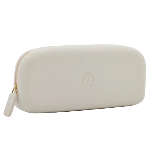 A light beige zippered a glass case with a gold zipper and a small embossed logo on the front, shown against a plain white background. Available at Be Charmed