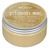 Jar of beach 'pinch me' therapy dough with a beige lid and body on a white background. Available at Be Charmed