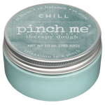 Jar of 'pinch me' therapy dough with a teal lid on a white background. Available at Be Charmed