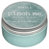 Jar of 'pinch me' therapy dough with a teal lid on a white background. Available at Be Charmed