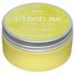 Yellow therapy dough jar with a silver lid on a white background. Available at Be Charmed