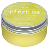 Yellow therapy dough jar with a silver lid on a white background. Available at Be Charmed