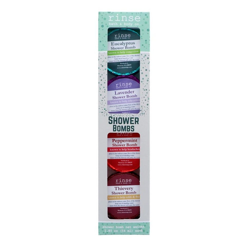 A pack of four shower bombs by Rinse Bath & Body, with labels indicating different scents such as Eucalyptus, Lavender, Peppermint, and Thieves. Available at Be Charmed
