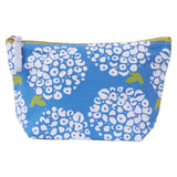 Blue pouch with white floral pattern on a white background. Available at Be Charmed