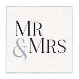 A Rustic Marlin square white wooden sign with a light natural wood border, featuring the text 'MR & MRS' in black serif font with a light gray ampersand. Available at Be Charmed