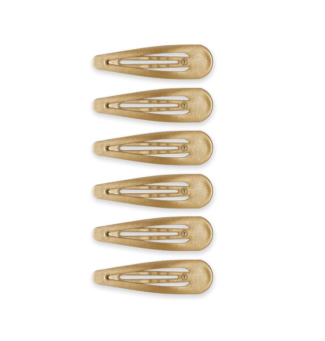 Six gold snap clips arranged vertically on a plain white background. Available at Be Charmed