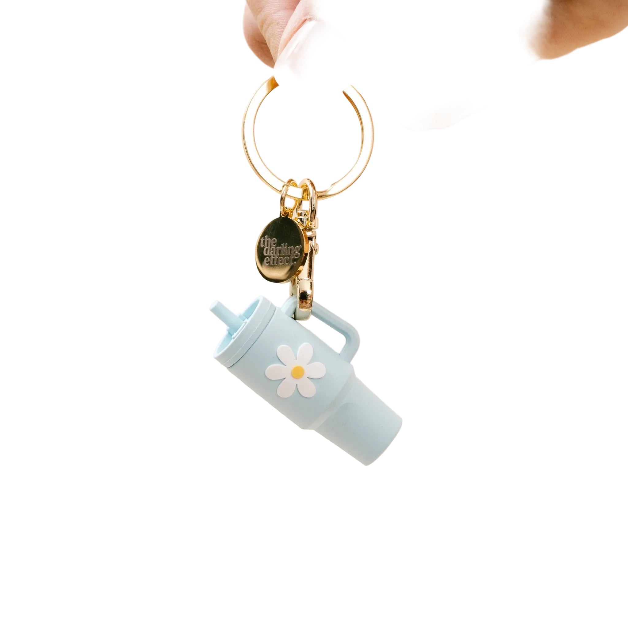 A aqua colored tumbler keychain with a flower detail on a white background, attached to a keyring. Available at Be Charmed