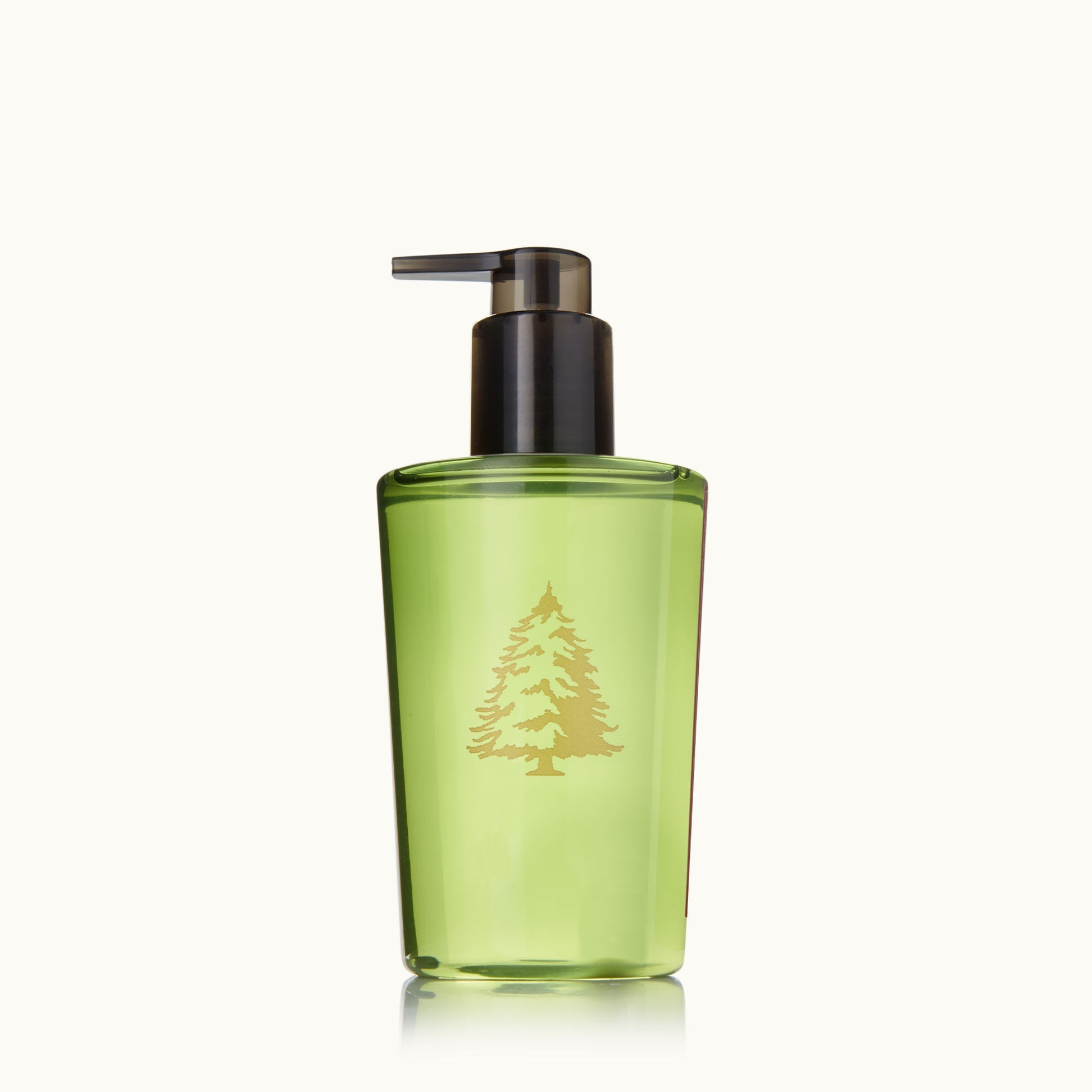 Frasier Fir Green bottle with pump dispenser on a white background. Available at Be Charmed