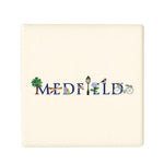 A square ceramic coaster with 'MEDFIELD' written on it and decorated with a blue bird, a bicycle, a tree, and a flower. Available at Be Charmed